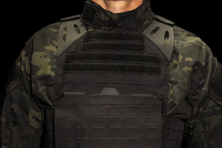 Model wearing Trooper LVPC Low Vis Plate Carrier Black front view hero image on blog post